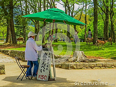 Woman selling snacks in Nara Park Editorial Stock Photo