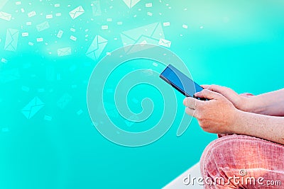 Woman send bulk messages from her smartphone Stock Photo
