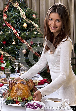 Woman serve Roasted turkey chicken for family christmas new year Stock Photo