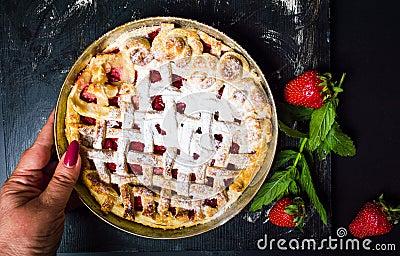 Woman serving strawberry sweet pie pastry dessert Stock Photo