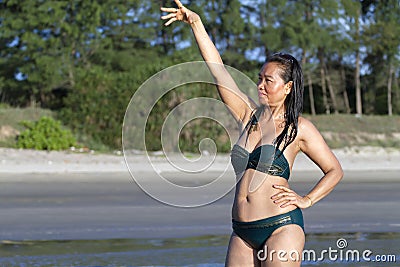 Woman shape pretty and bikini relax on beach Stock Photo