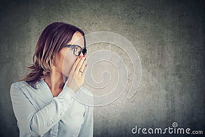 Woman sharing a secret privately Stock Photo