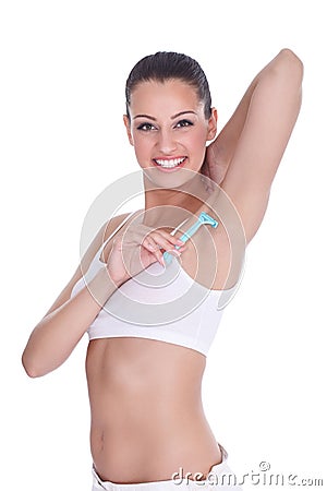 Woman shaving armpits Stock Photo