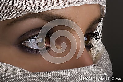 Woman with shawl on face Stock Photo