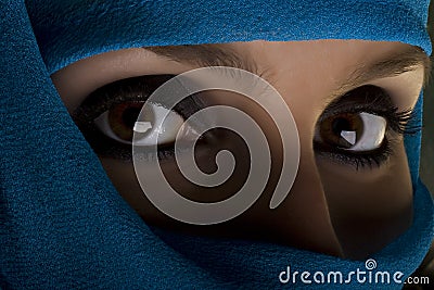 Woman with shawl on face Stock Photo