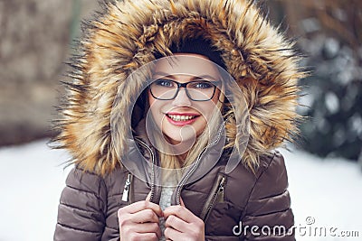 Woman shiver outdoor at winter in glasses Stock Photo