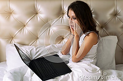 Woman shoked looking in laptop Stock Photo