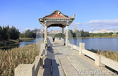 Woman shooting Anping Stone Bridge, adobe rgb Stock Photo