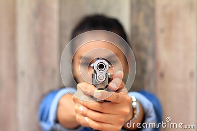 Woman at the shooting range shot from a revolvers Stock Photo