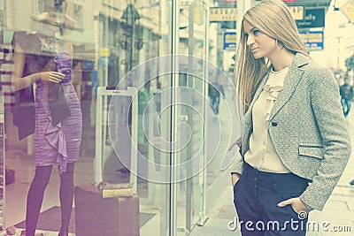 Woman in shoping street looking at window Stock Photo