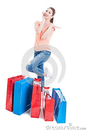 Woman shopper standing and feeling joyful with many shopping bag Stock Photo