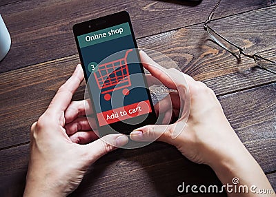 A woman is shopping at the online store. Cart icon. Ecommerce. Stock Photo
