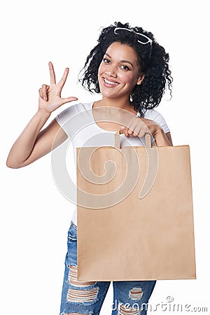 Woman with shopping showing three fingers Stock Photo