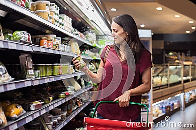 Woman shopping in supermarket Stock Photo