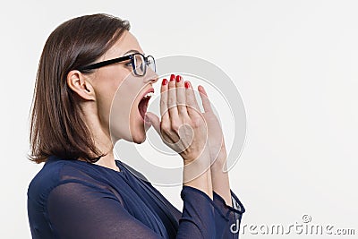 Woman shouting, screaming portrait in profile. white background. Stock Photo