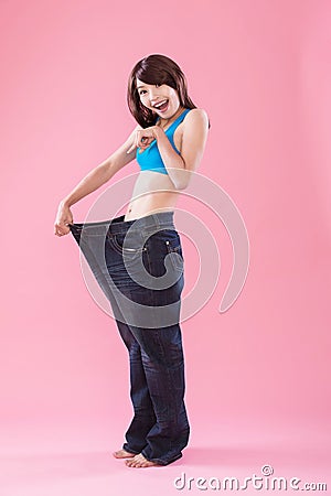 Woman show weight loss Stock Photo