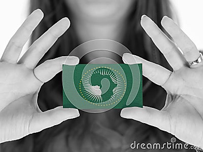 Woman showing a business card - African Union Stock Photo