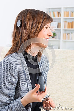 Woman showing cochlear implant Stock Photo