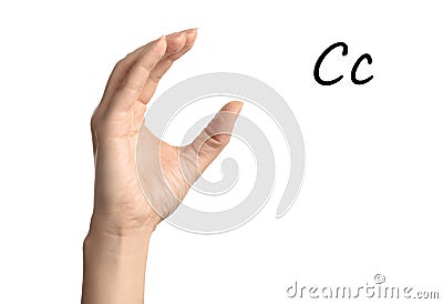 Woman showing letter C on background, closeup. Sign language Stock Photo