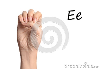 Woman showing letter E on background, closeup. Sign language Stock Photo