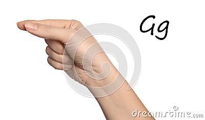 Woman showing letter G on background, closeup. Sign language Stock Photo