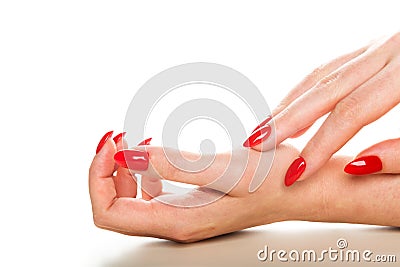 Woman showing manicured hands with red nail polish Stock Photo