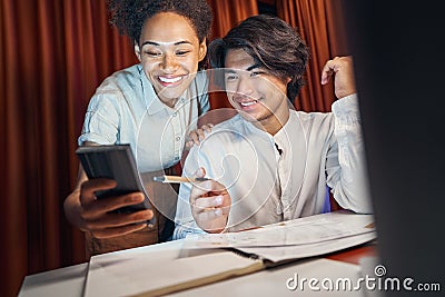 Woman showing news to colleague on phone screen Stock Photo