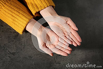 Woman showing palms at table. Chiromancy and foretelling Stock Photo