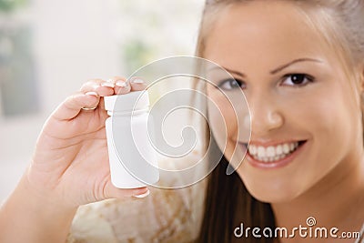 Woman showing pill bottle Stock Photo