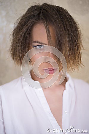 A woman showing a serious stern look Stock Photo