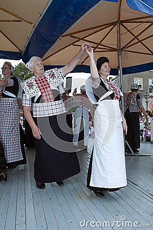 Woman shows original dutch dance in costume Editorial Stock Photo