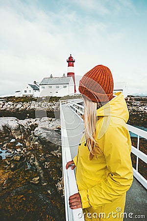 Woman sightseeing Norway lighthouse Travel Lifestyle Stock Photo