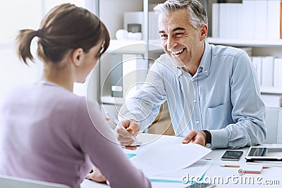 Woman signing a contract Stock Photo