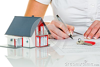 Woman signs purchase agreement for house Stock Photo