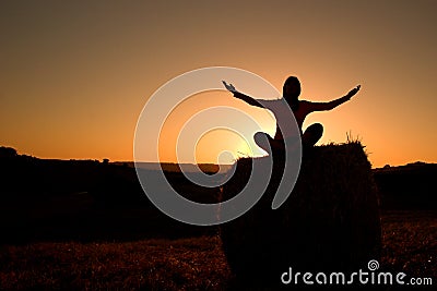 Woman silhouette making yoga Stock Photo