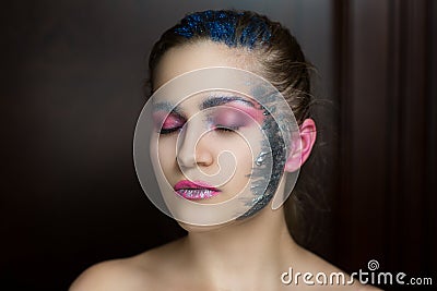 Woman with silver paints Stock Photo
