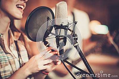 Woman singer in a studio Stock Photo
