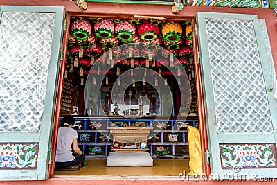 Woman sit and make meditation in ancient Chinese style shire Editorial Stock Photo