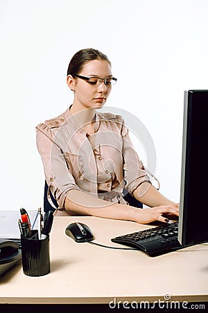 Woman sits at the computer Stock Photo