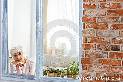 Woman sitting alone Stock Photo