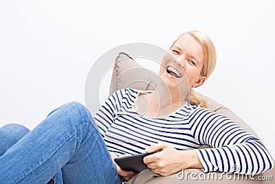 Woman sitting on a beanbag Stock Photo