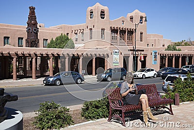 Woman sitting on the bench in Santa Fe Editorial Stock Photo