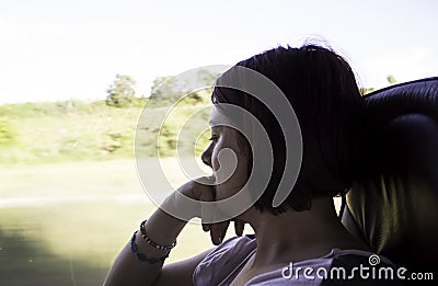 Woman sitting in a bus Stock Photo