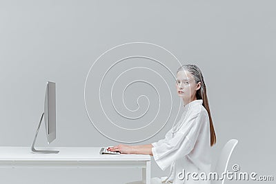Woman sitting at the desk with computer, pc Stock Photo