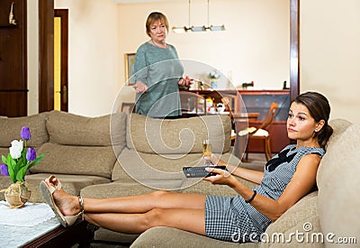 Woman sitting with glass of wine having conflict with mother Stock Photo