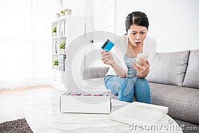 Woman is unsatisfied with purchase from e-shop Stock Photo