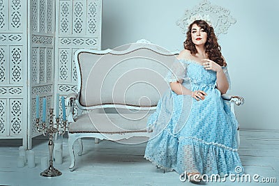 Woman sitting on the sofa. Stock Photo