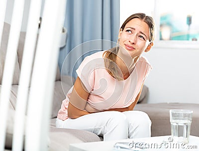 Woman suffering from abdominal pain Stock Photo