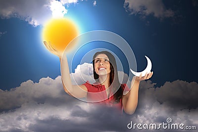 Woman in sky holds moon and sun, collage Stock Photo