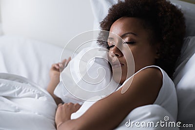 Woman sleeping in her bed Stock Photo